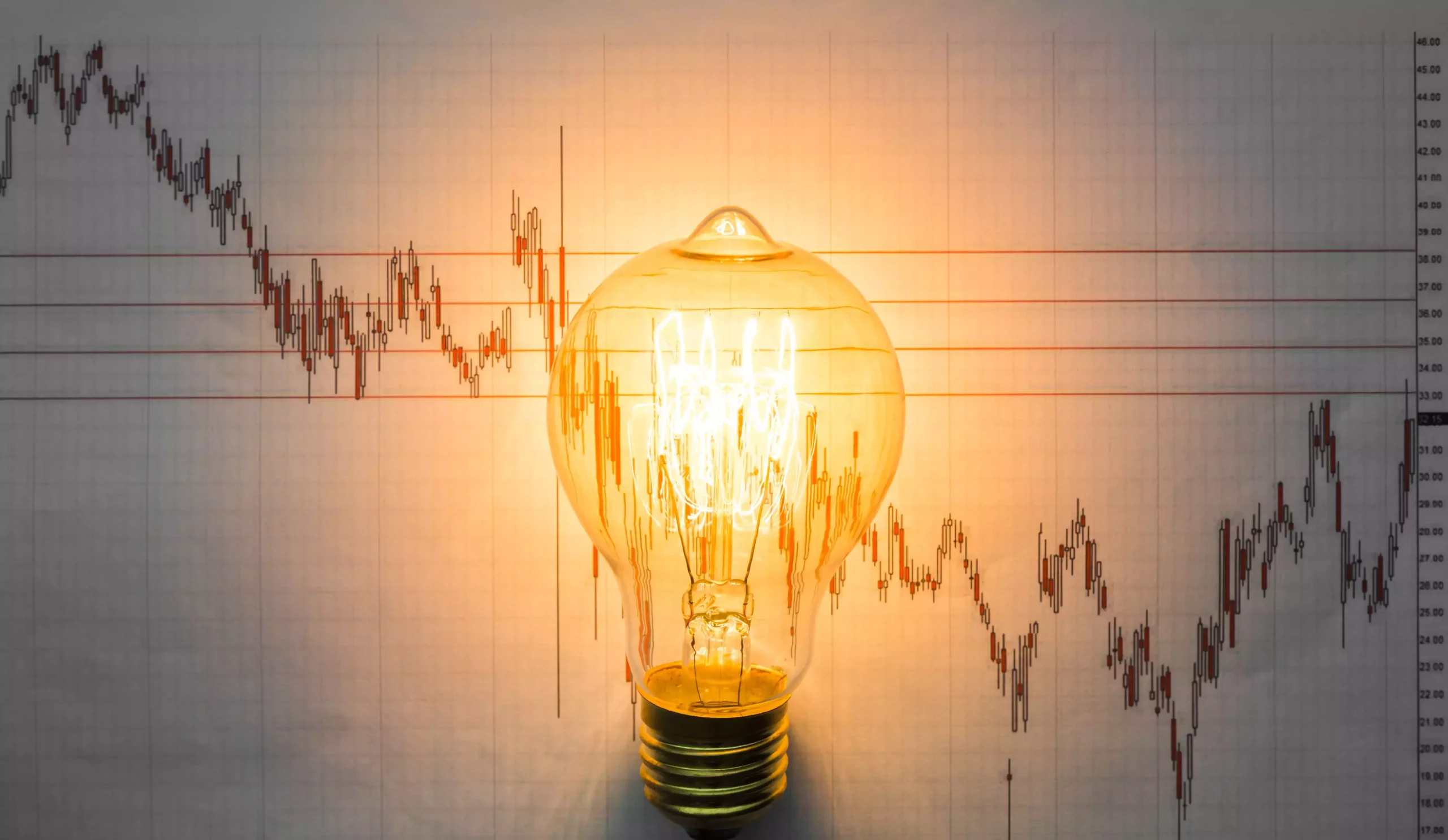 lit-light-bulb-with-graph-background (1)-min